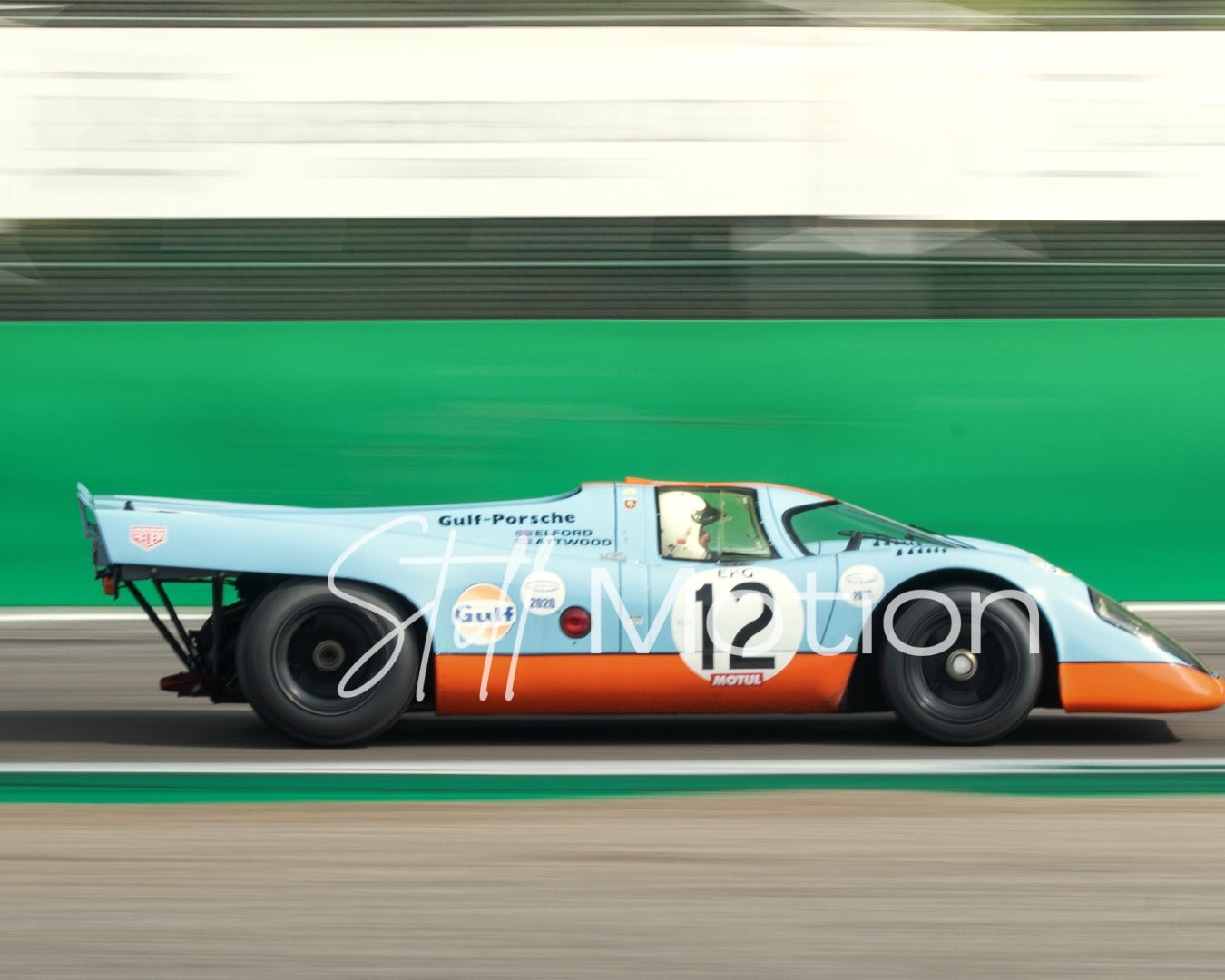 Close-up of Porsche 917K Imola aluminium print showing motion blur and Gulf livery detail on satin aluminium surface