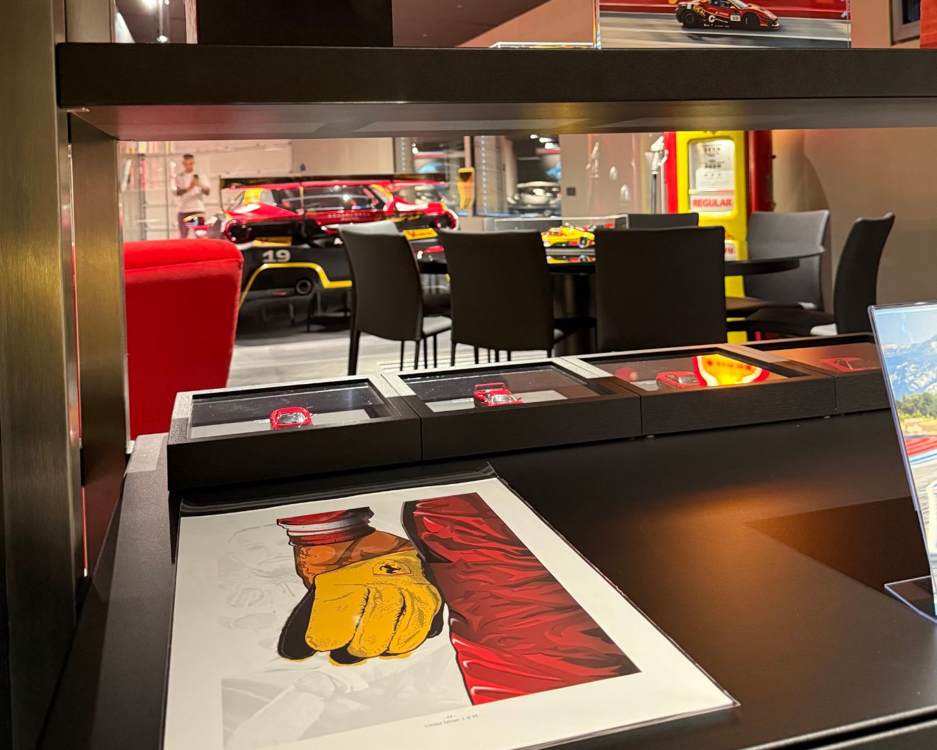 Lewis Hamilton 44 The Yellow Glove limited edition illustration in black gallery frame displayed at the Ferrari Collector Car Lounge in the Northern taly