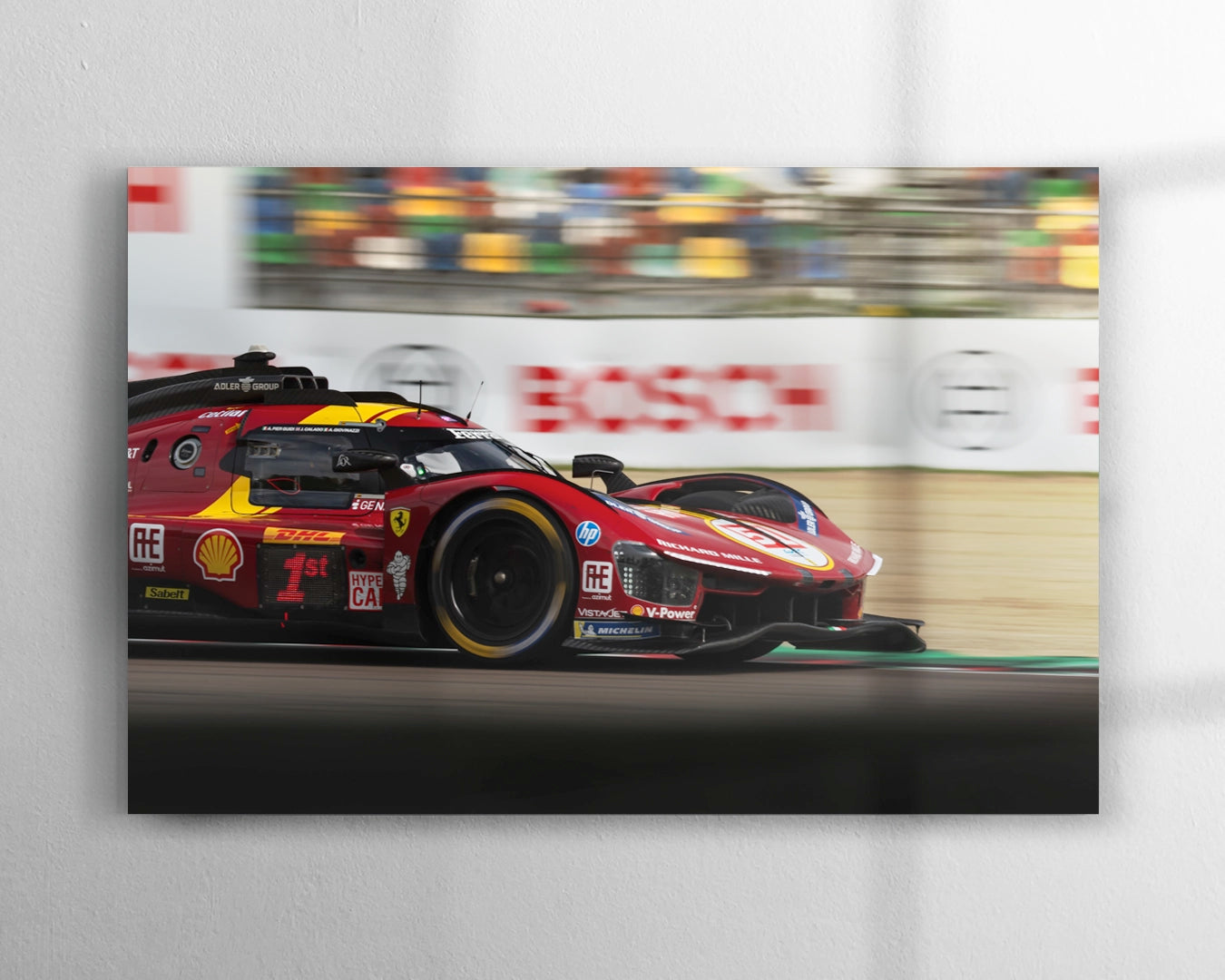 Ferrari 499P number 51 Le Mans Hypercar at speed through Villeneuve Turn at Imola panning shot with motion blur background during FIA WEC