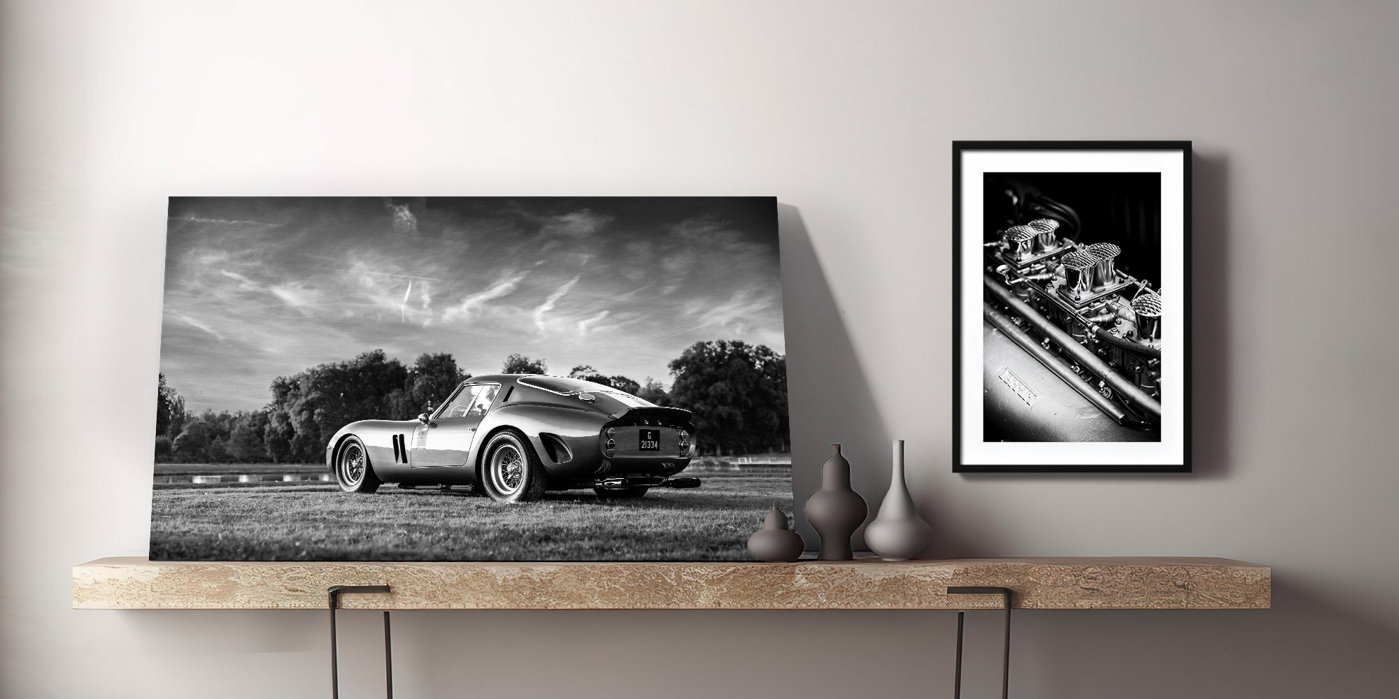 Dark cinematic display of classic Ferrari fine art prints, setting the stage for The Black Book collector registry by Invictus Heights.