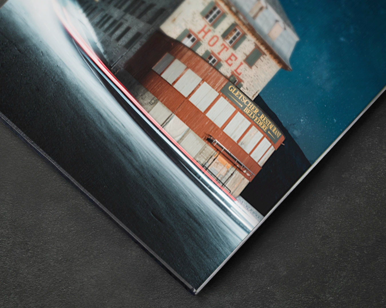 Close-up of Hotel Belvédère aluminium print showing tonal depth of night sky and light trails on satin aluminium surface