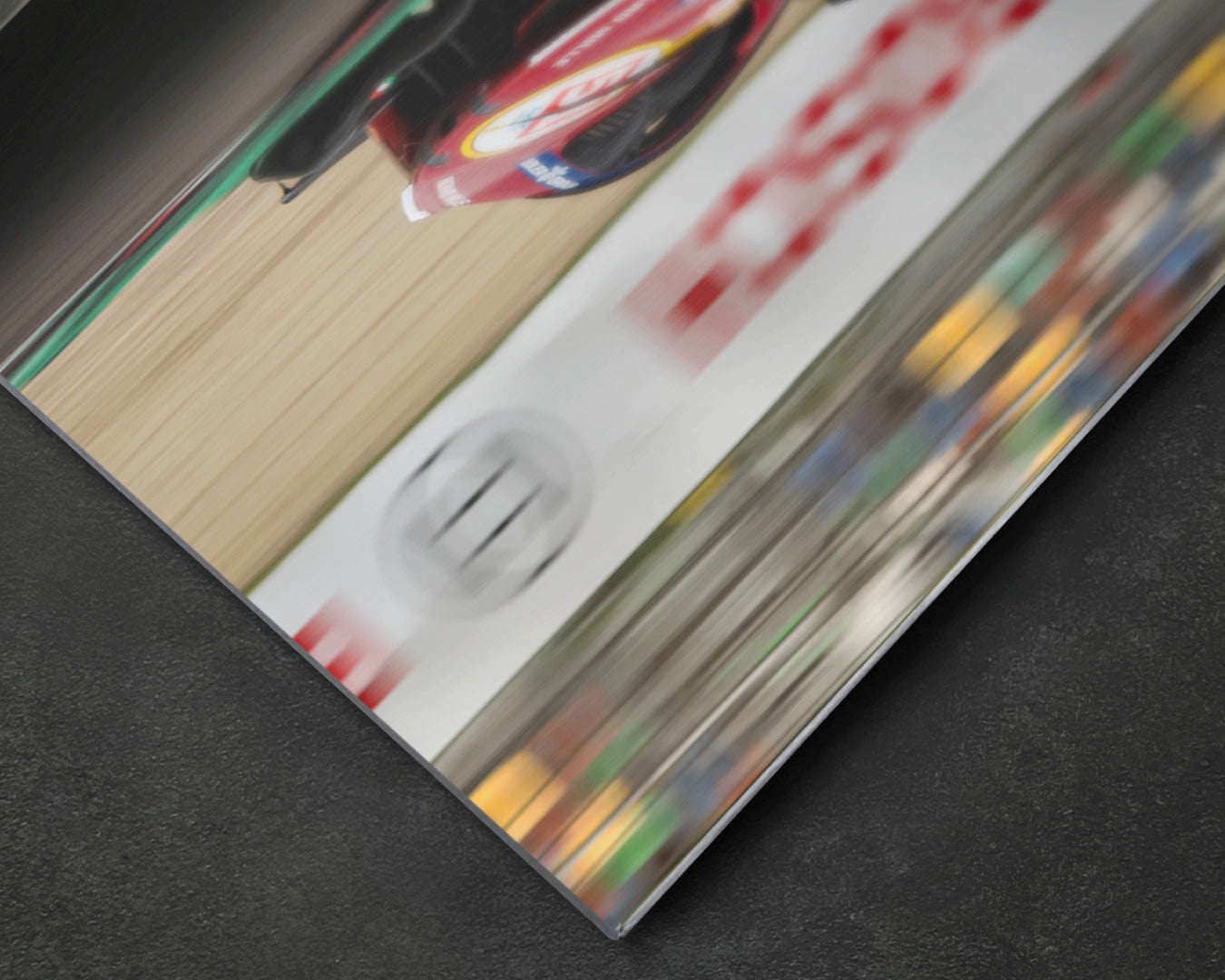 Close-up of Ferrari 499P aluminium print showing motion blur and aerodynamic detail on satin aluminium surface