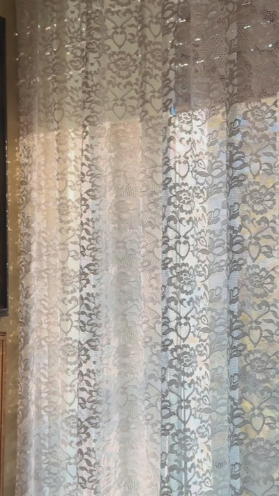 A calm, dark pan revealing a museum-grade automotive artwork of Lewis Hamilton in Milan.